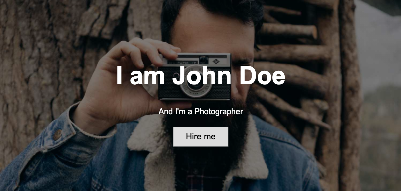 Example of a hero image, showing a background image of a photographer with text on top.