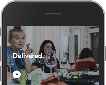 Screenshot showing the white text Delivered on top of an image background.